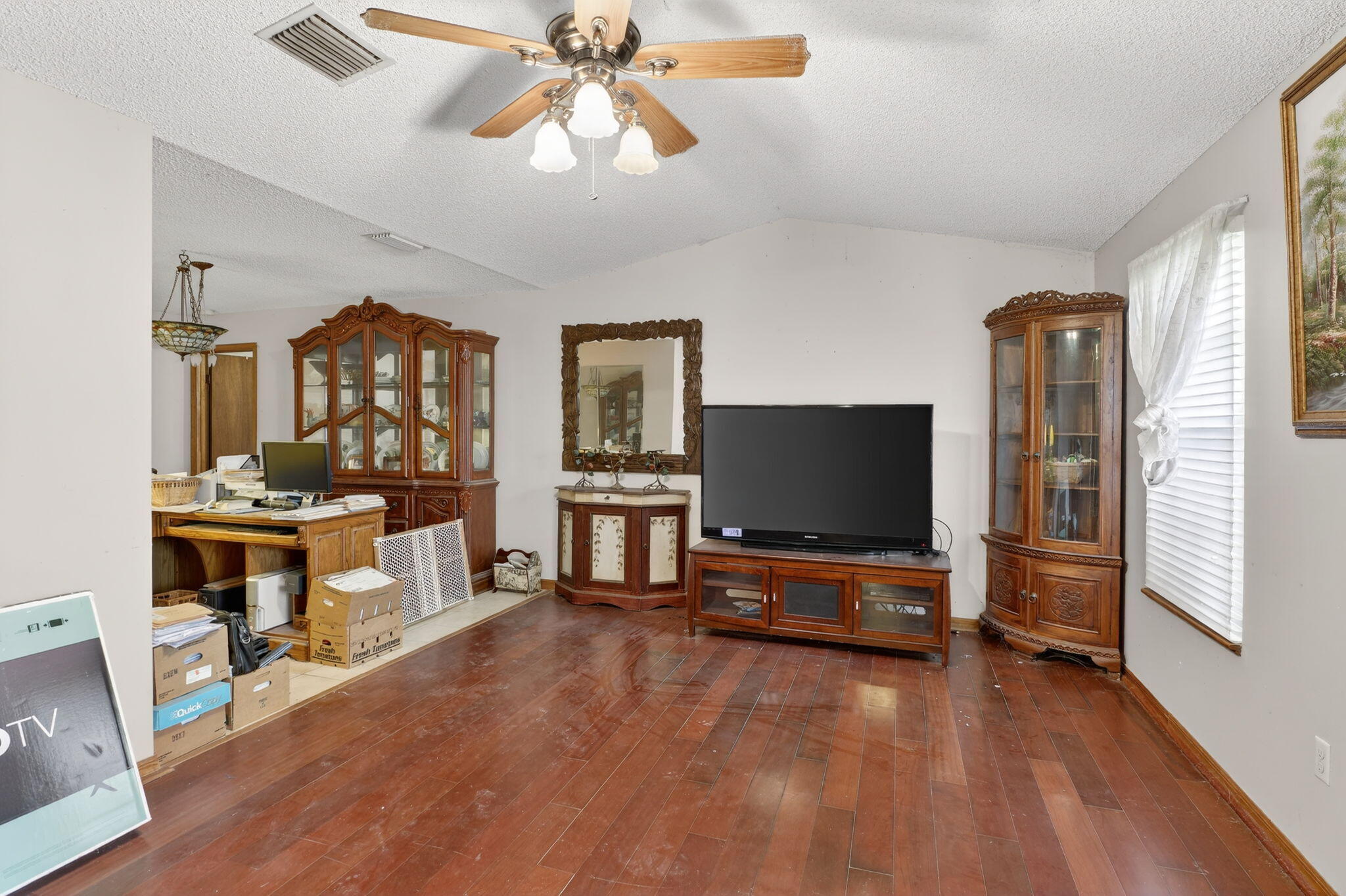 3133 Fairview Drive Melbourne, FL 32934 - Photo 5 of 45 a living room with furniture and a flat screen tv