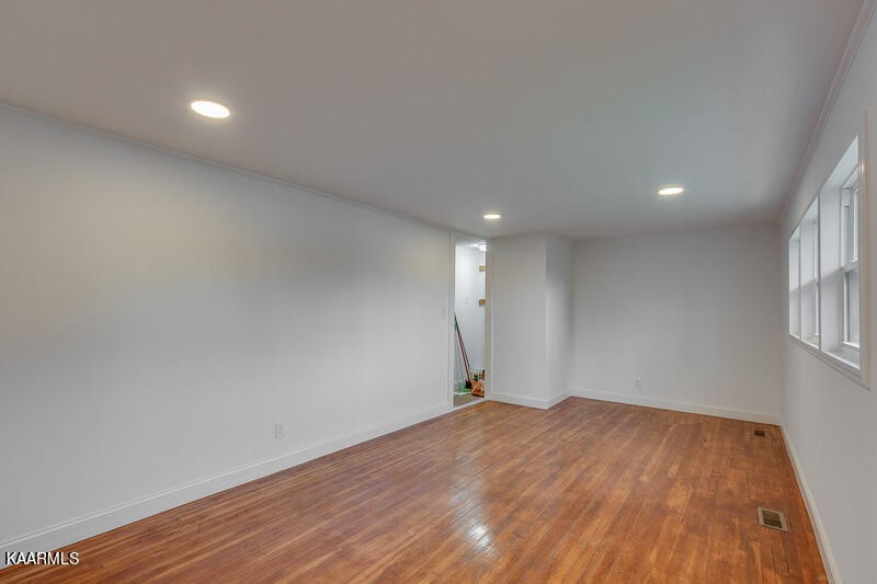 149 Alger Road Oak Ridge, TN 37830 - Photo 6 of 20 a view of empty room with wooden floor and fan
