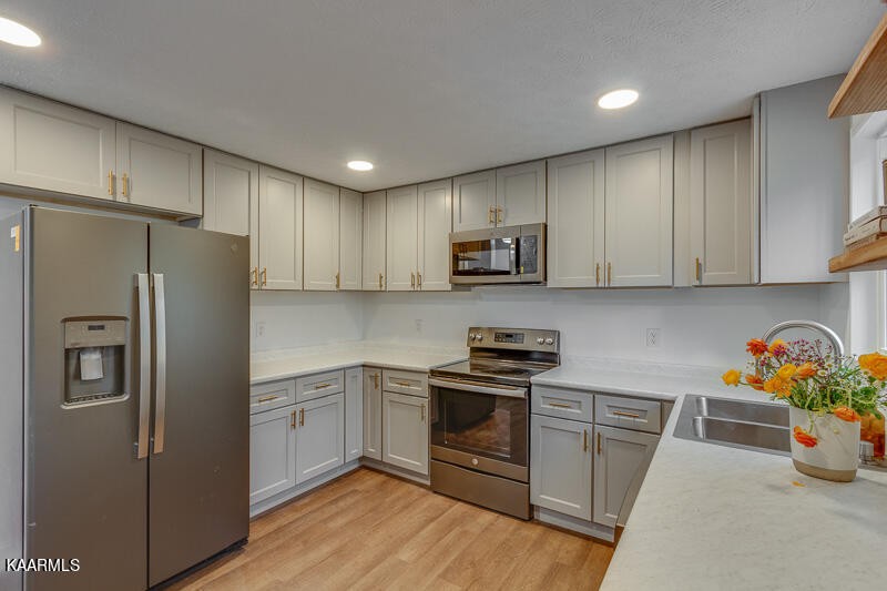 149 Alger Road Oak Ridge, TN 37830 - Photo 10 of 20 a kitchen with stainless steel appliances granite countertop a refrigerator sink and microwave