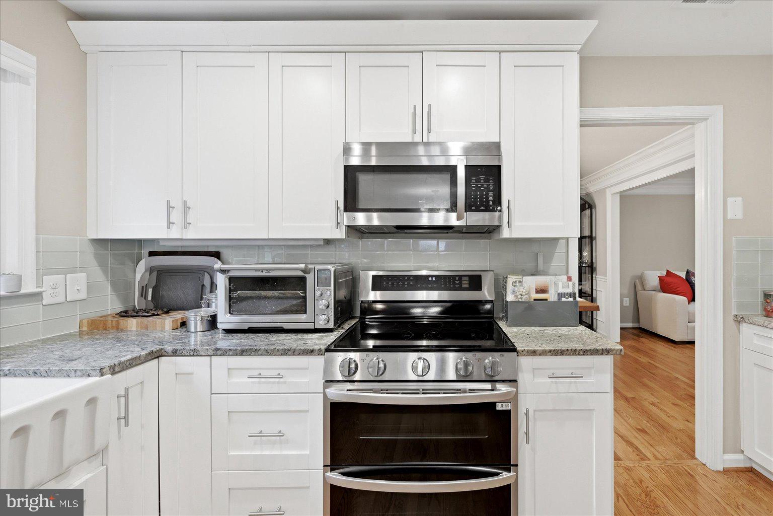 911 Riva Ridge Drive Great Falls, VA 22066 - Photo 16 of 55 Modern kitchen with sleek finishes.
