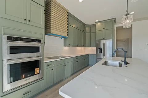 a kitchen with cabinets and a sink