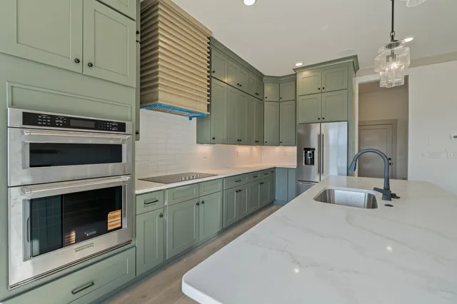 a spacious bathroom with a sink a washer and dryer