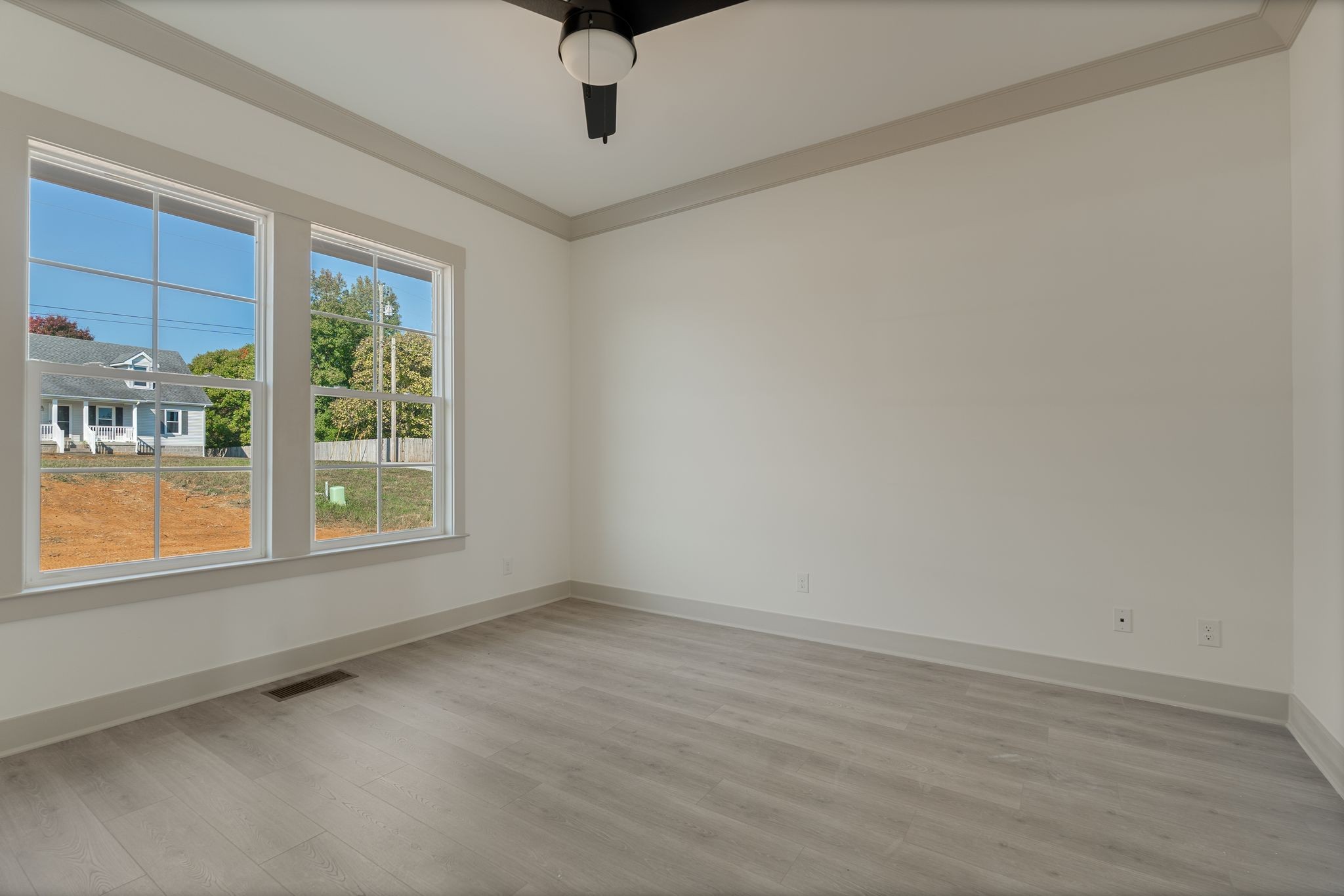 5509 East Overall Creek Road Rockvale, TN 37153 - Photo 22 of 36 a view of an empty room with a window and wooden floor
