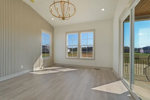 a spacious bathroom with a double vanity sink mirror and bathtub