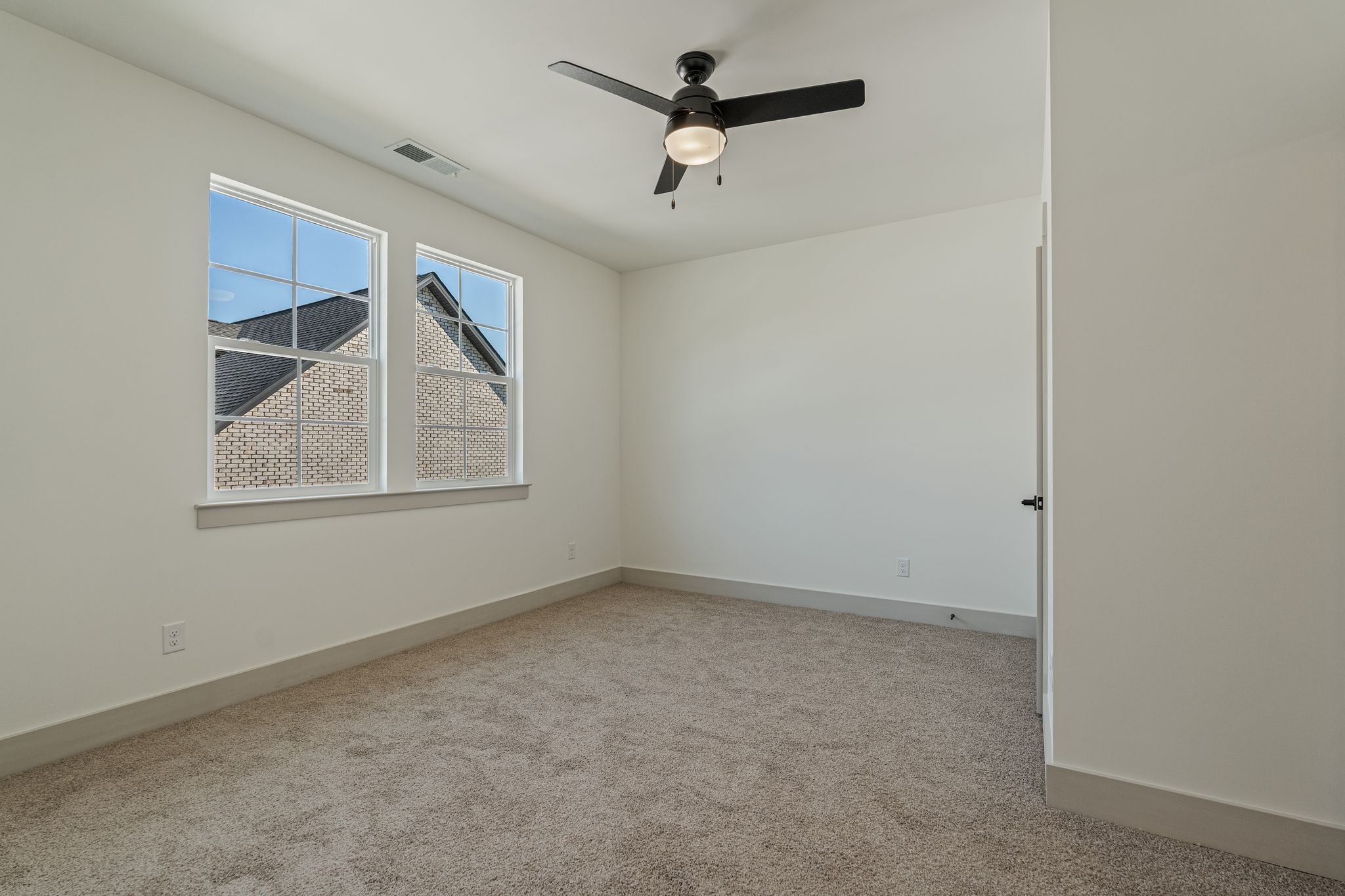 5509 East Overall Creek Road Rockvale, TN 37153 - Photo 24 of 36 an empty room with ceiling fan and windows