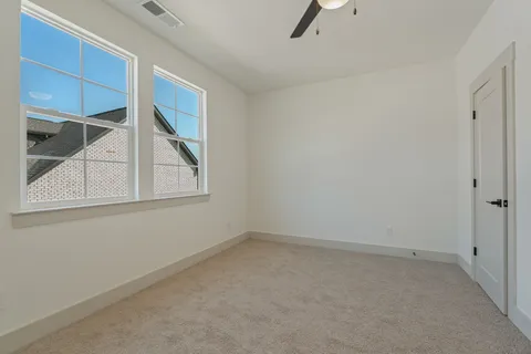 a bathroom with a granite countertop sink a mirror and shower
