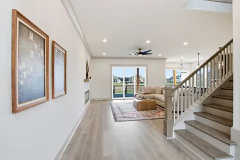 a view of an entryway with wooden floor