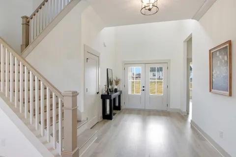 a living room with furniture and a rug