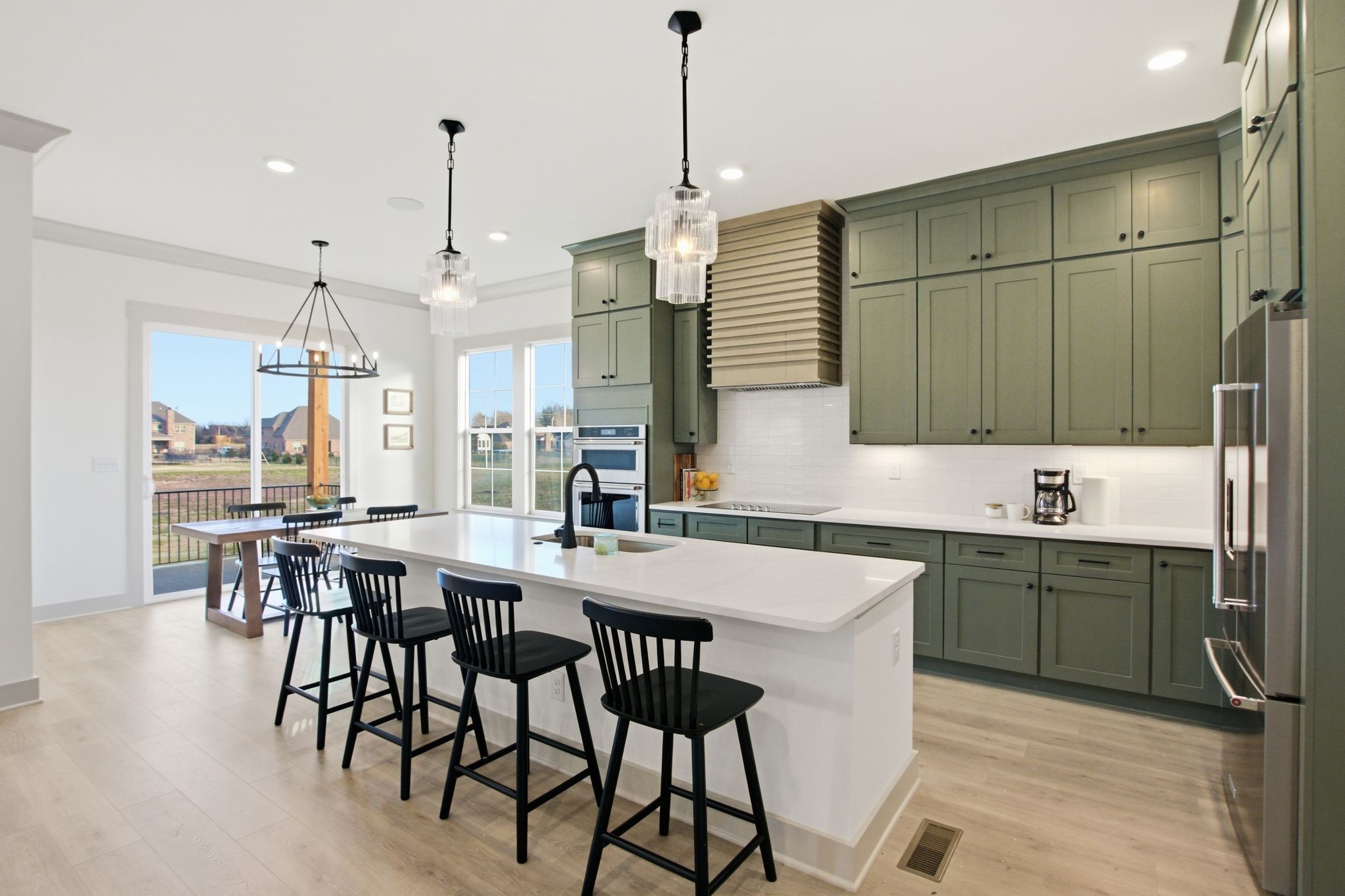 5509 East Overall Creek Road Rockvale, TN 37153 - Photo 7 of 36 a kitchen with a table chairs sink and cabinets