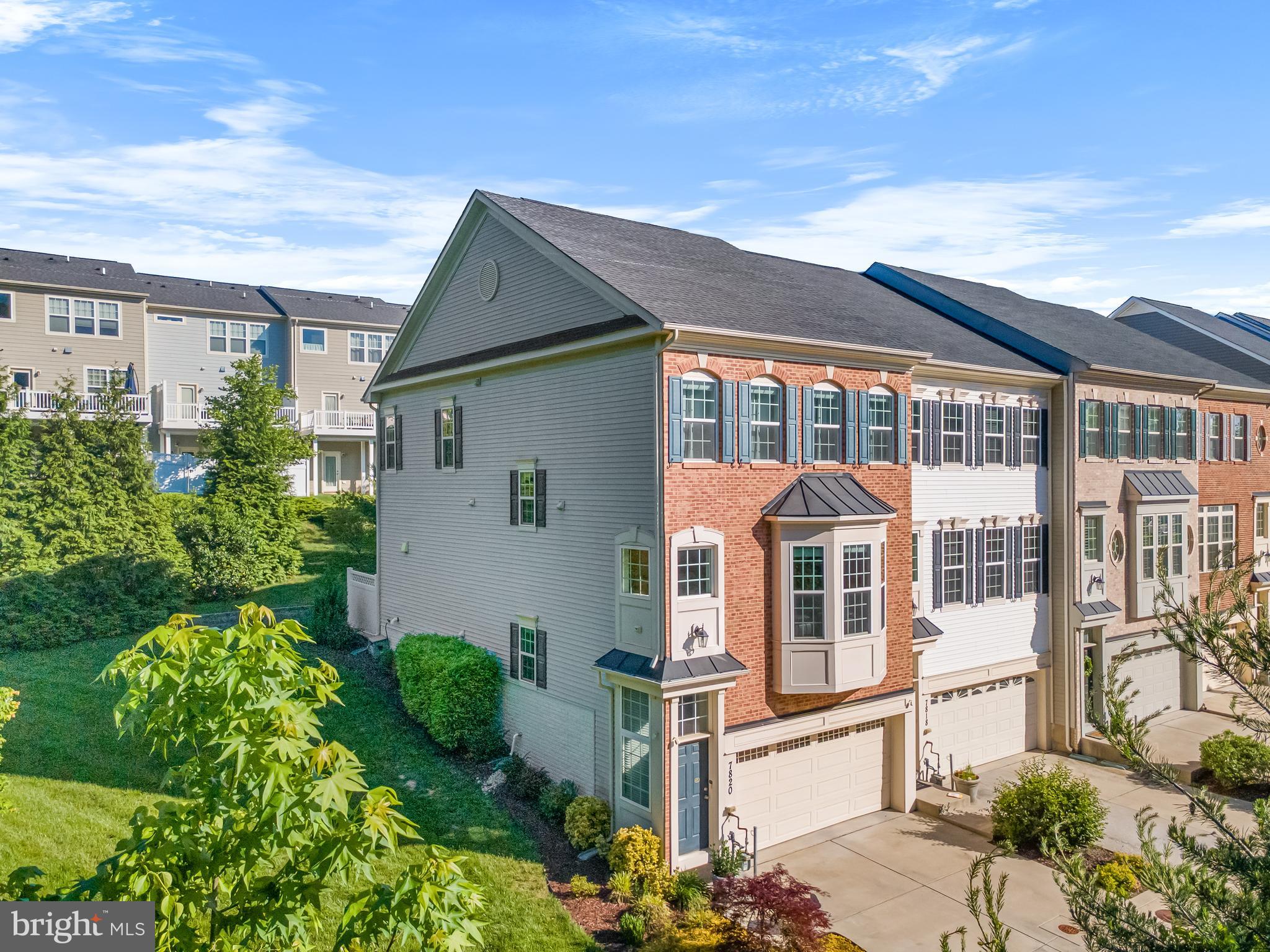 front view of a house with a garden