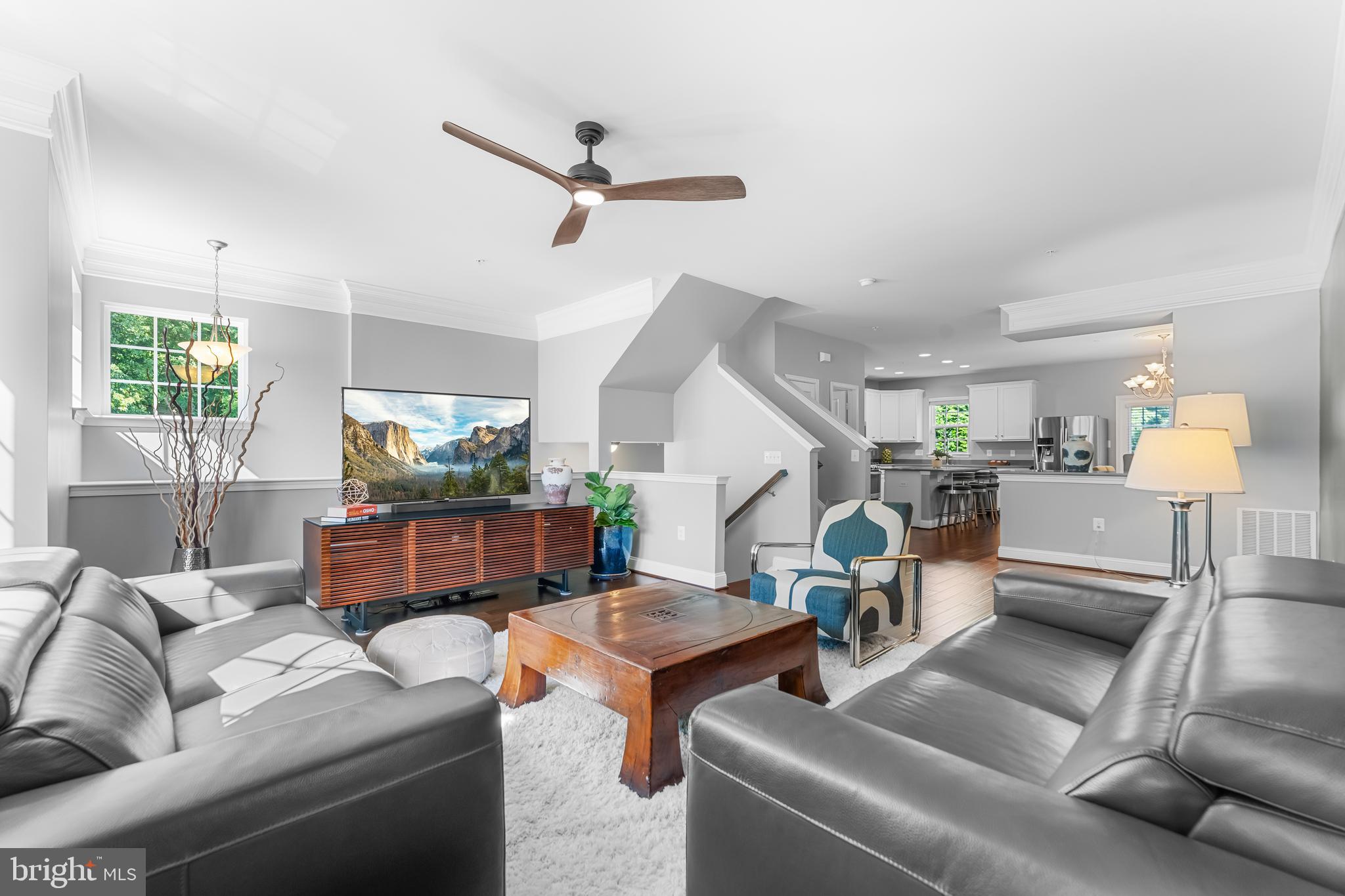 7820 Loblolly Way Hanover, MD 21076 - Photo 12 of 75 a living room with furniture and a wooden floor
