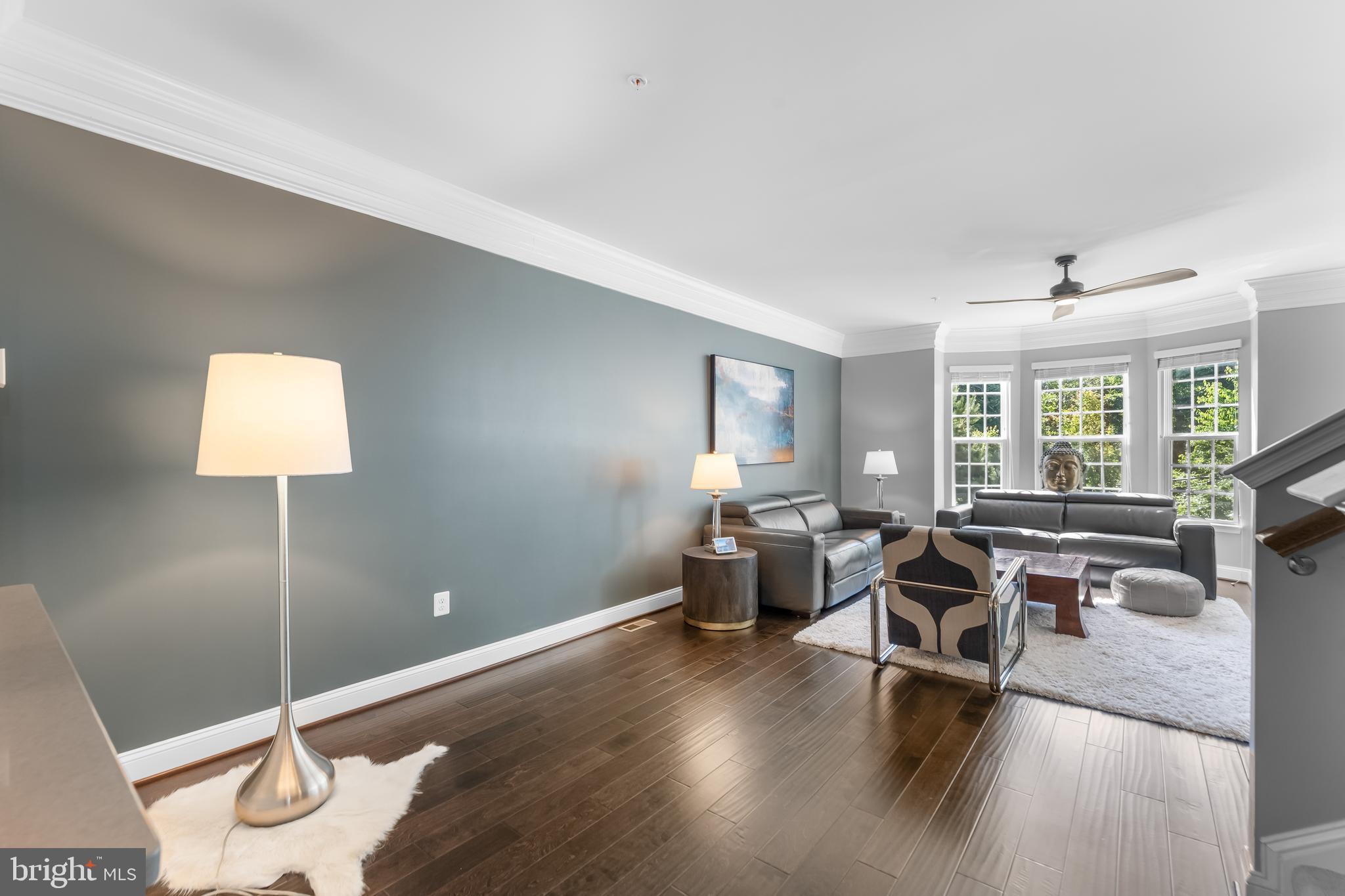 7820 Loblolly Way Hanover, MD 21076 - Photo 13 of 75 a living room with furniture and wooden floor