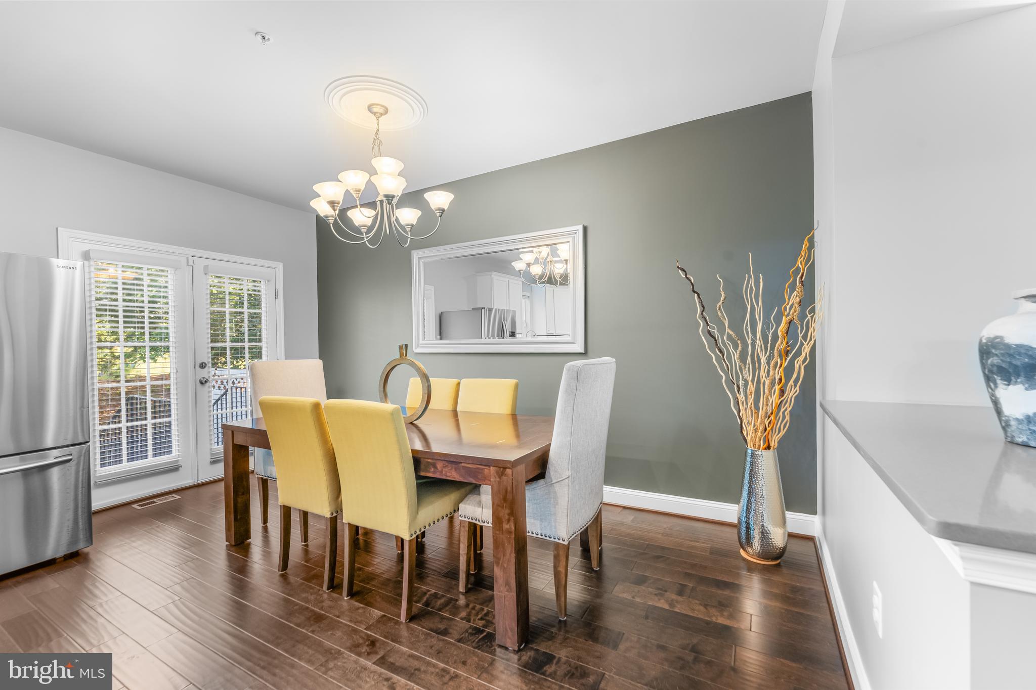 7820 Loblolly Way Hanover, MD 21076 - Photo 14 of 75 a view of a dining room with furniture and wooden floor