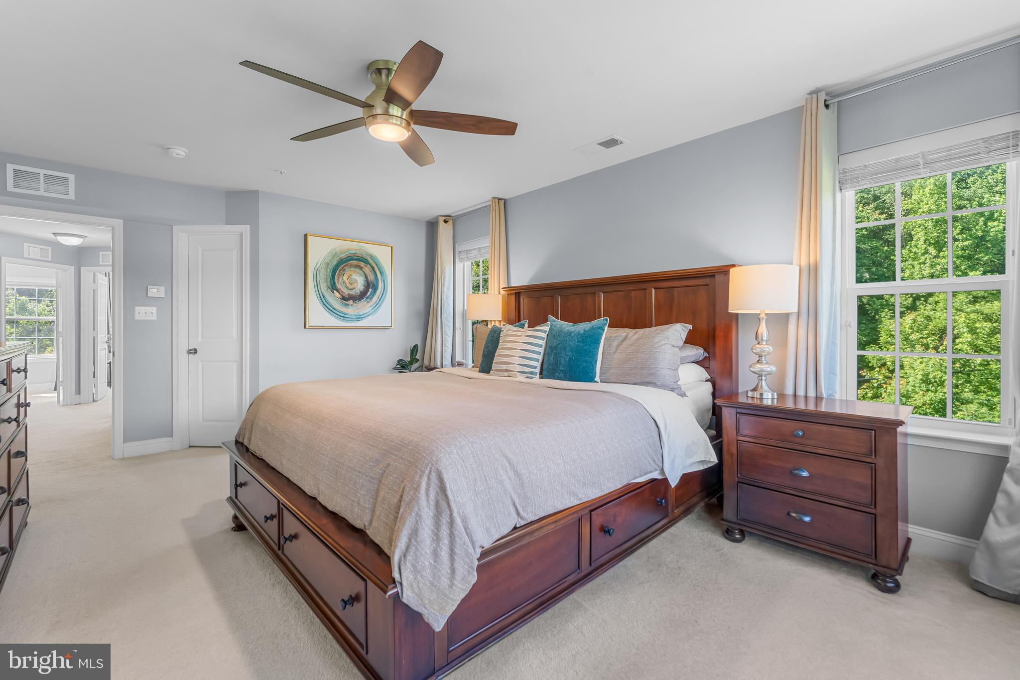 7820 Loblolly Way Hanover, MD 21076 - Photo 18 of 75 a spacious bedroom with a bed and a large window