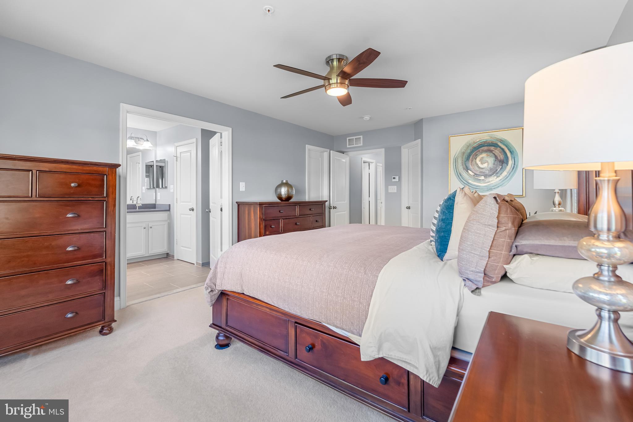 7820 Loblolly Way Hanover, MD 21076 - Photo 20 of 75 a bed room with a bed and a chandelier