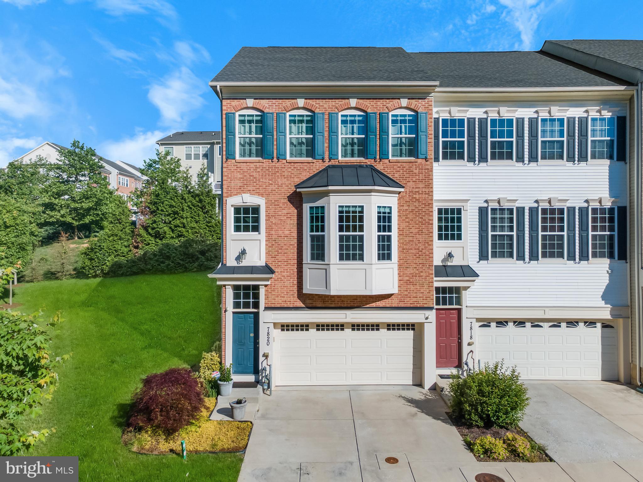 7820 Loblolly Way Hanover, MD 21076 - Photo 2 of 75 a front view of a house with a yard