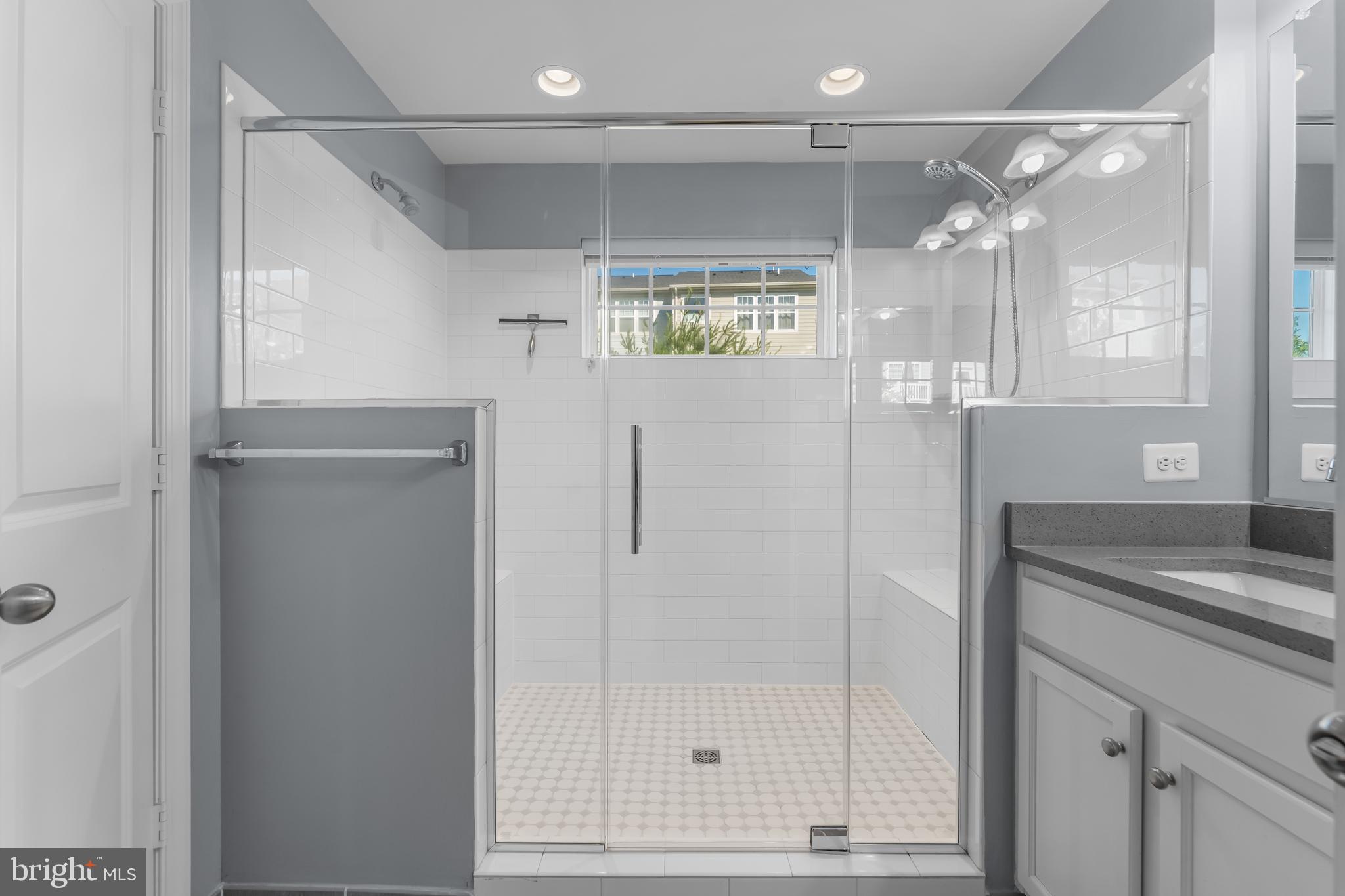 7820 Loblolly Way Hanover, MD 21076 - Photo 27 of 75 a bathroom with a shower and a sink a mirror