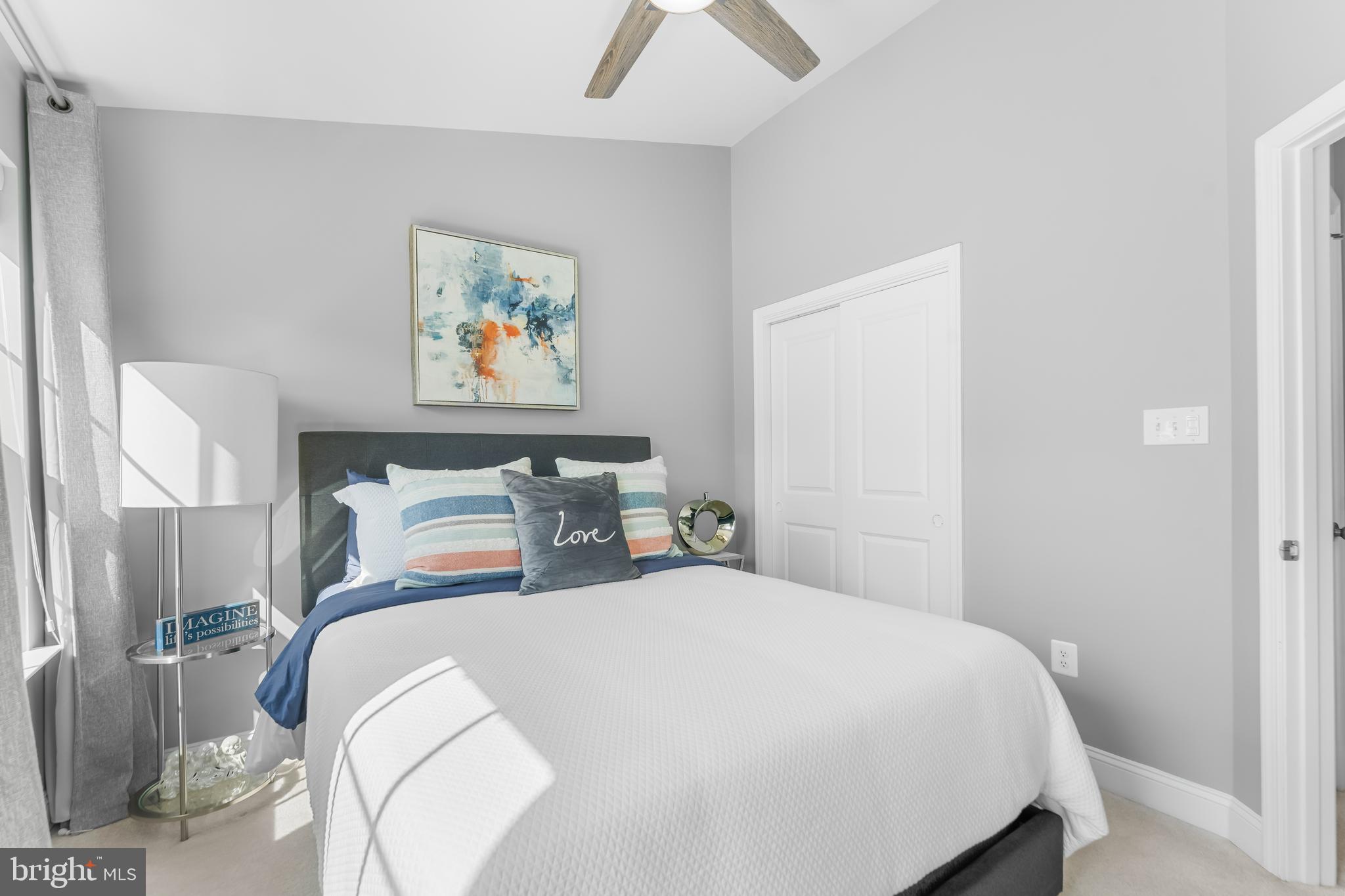 7820 Loblolly Way Hanover, MD 21076 - Photo 31 of 75 a bedroom with a bed and a painting on the wall