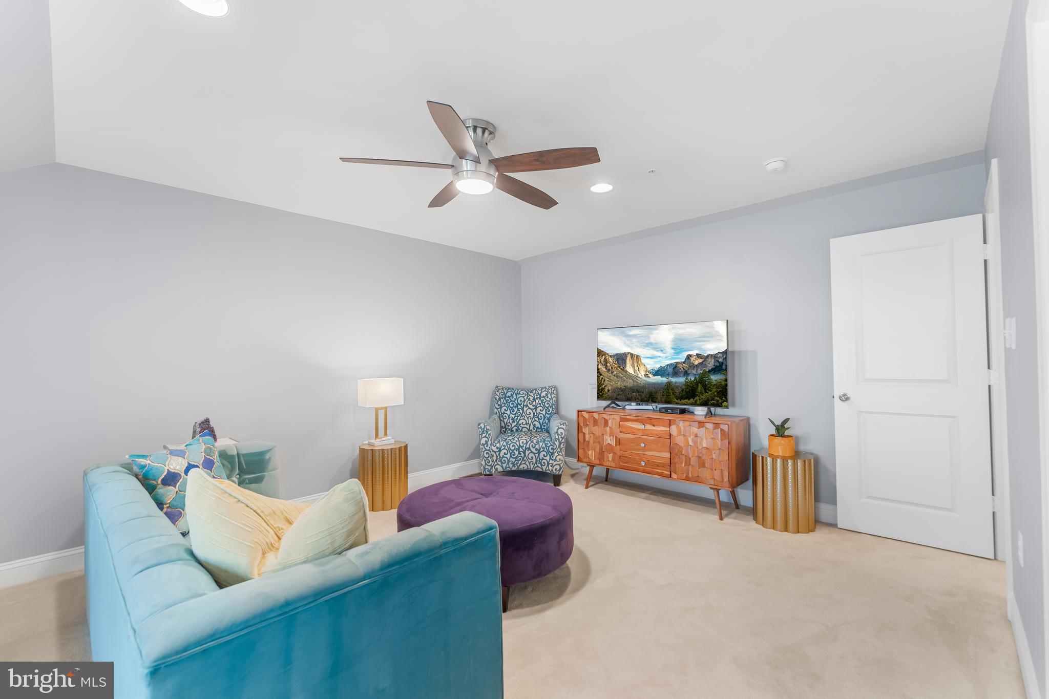 7820 Loblolly Way Hanover, MD 21076 - Photo 37 of 75 a living room with furniture and a ceiling fan