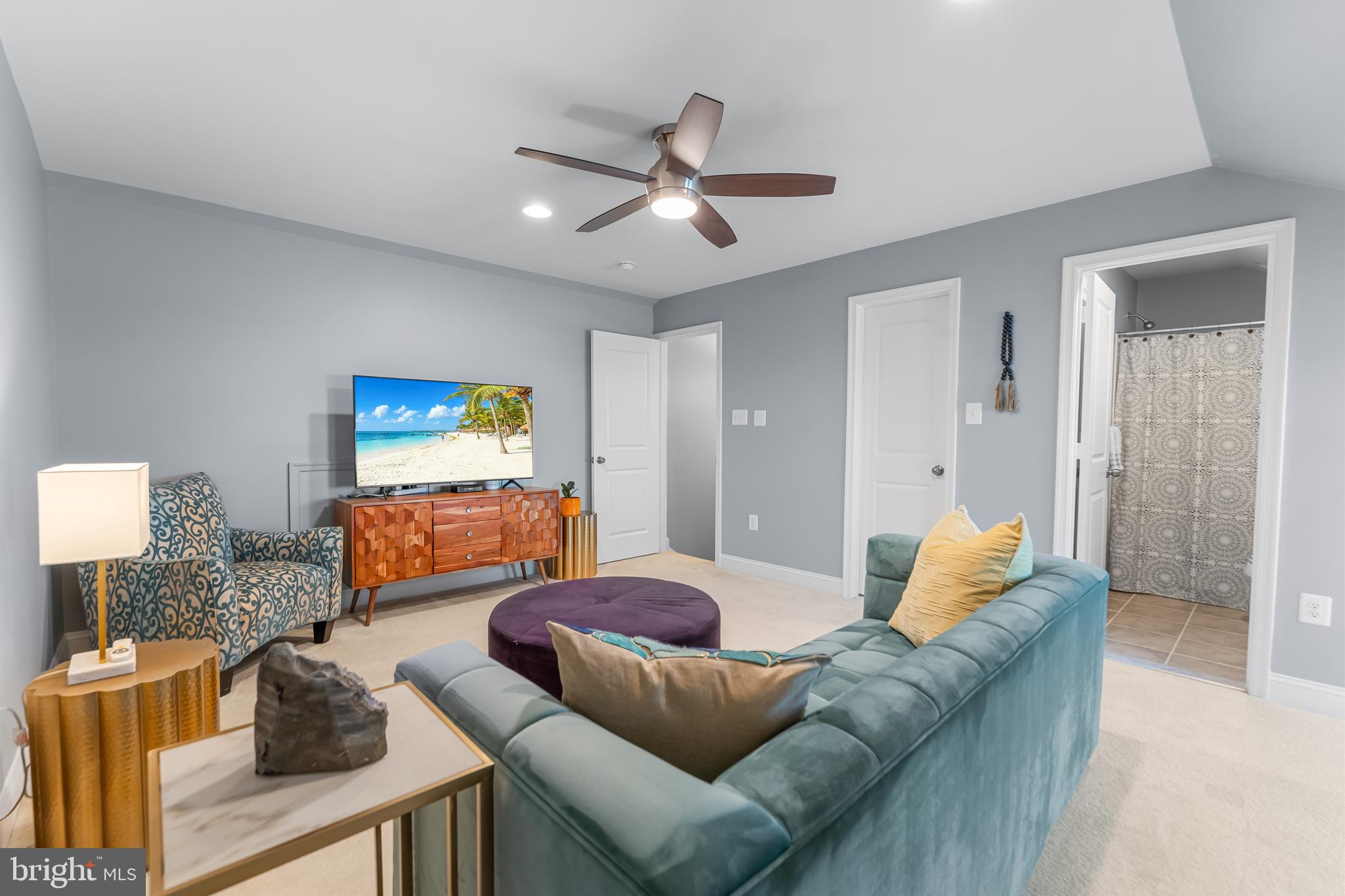 7820 Loblolly Way Hanover, MD 21076 - Photo 39 of 75 a living room with furniture and a projector
