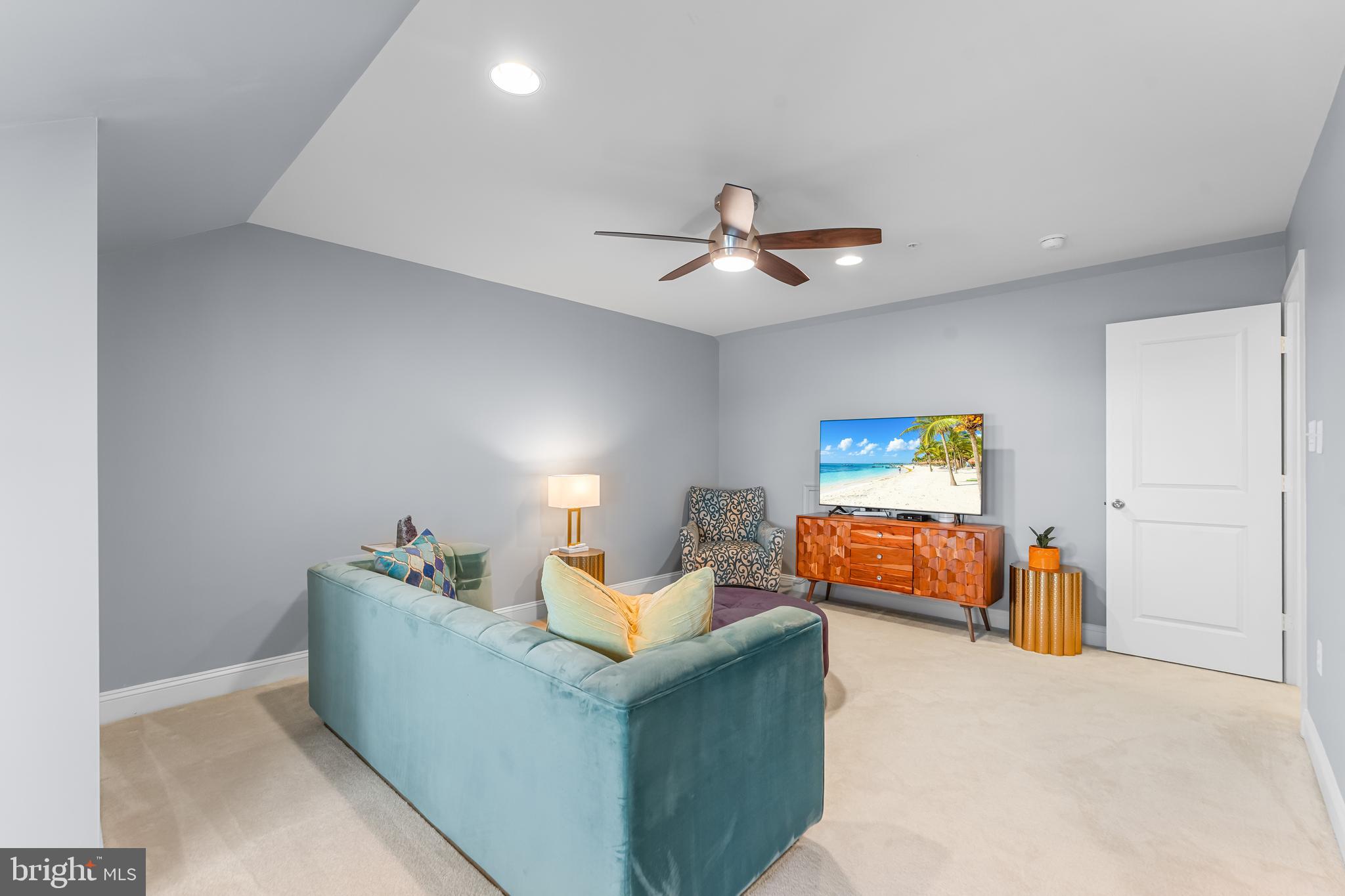 7820 Loblolly Way Hanover, MD 21076 - Photo 40 of 75 a living room with furniture and a ceiling fan
