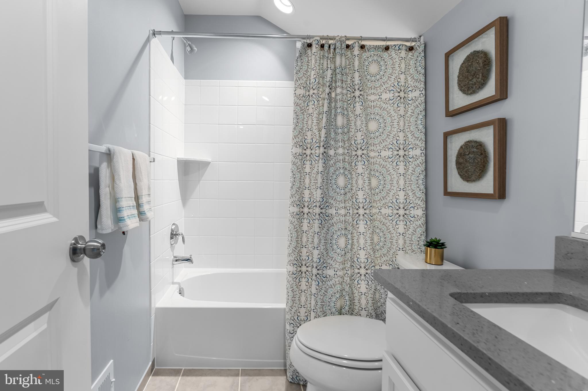 7820 Loblolly Way Hanover, MD 21076 - Photo 43 of 75 a bathroom with a sink a toilet and shower