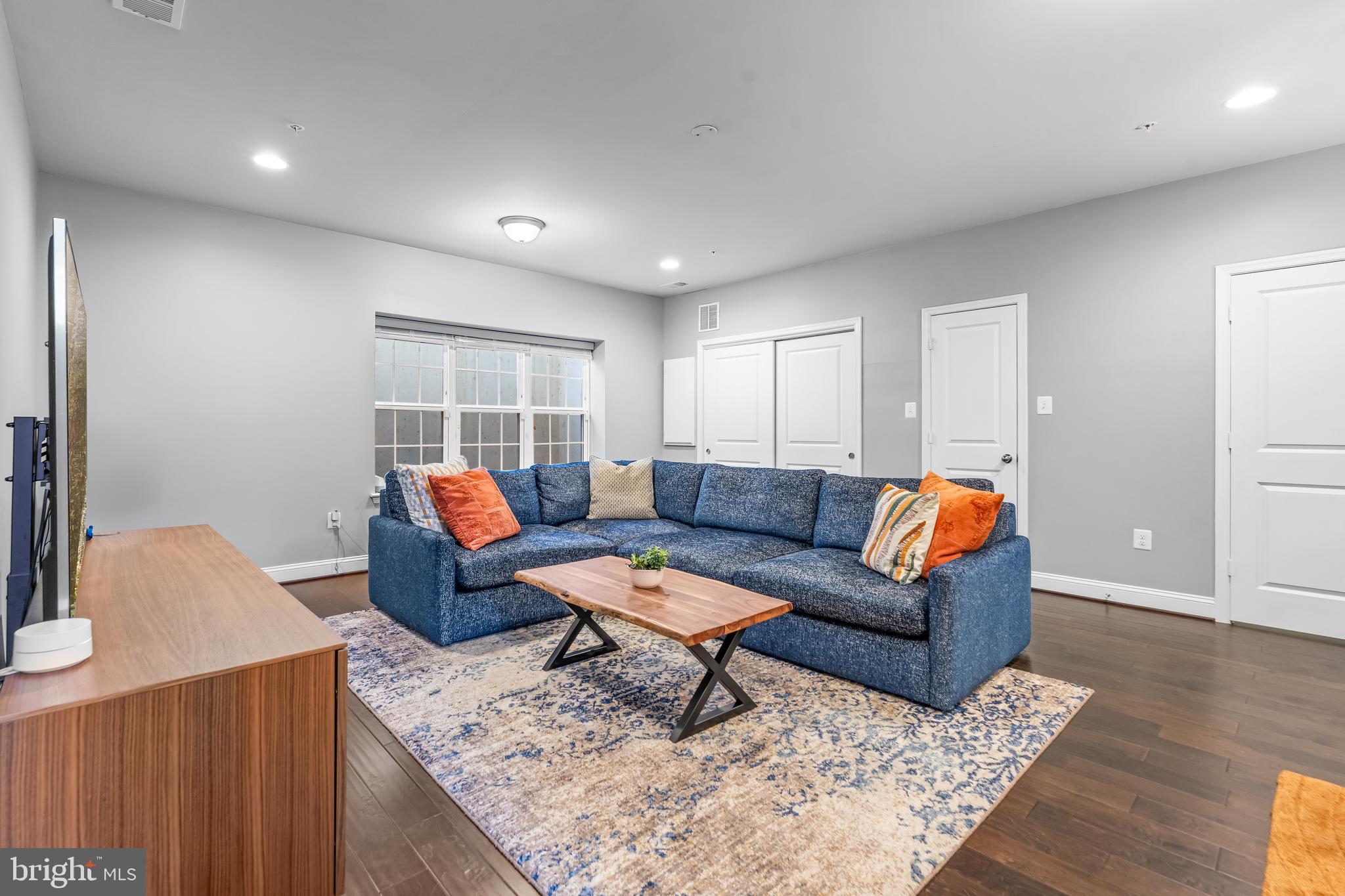 7820 Loblolly Way Hanover, MD 21076 - Photo 44 of 75 a living room with furniture and a table