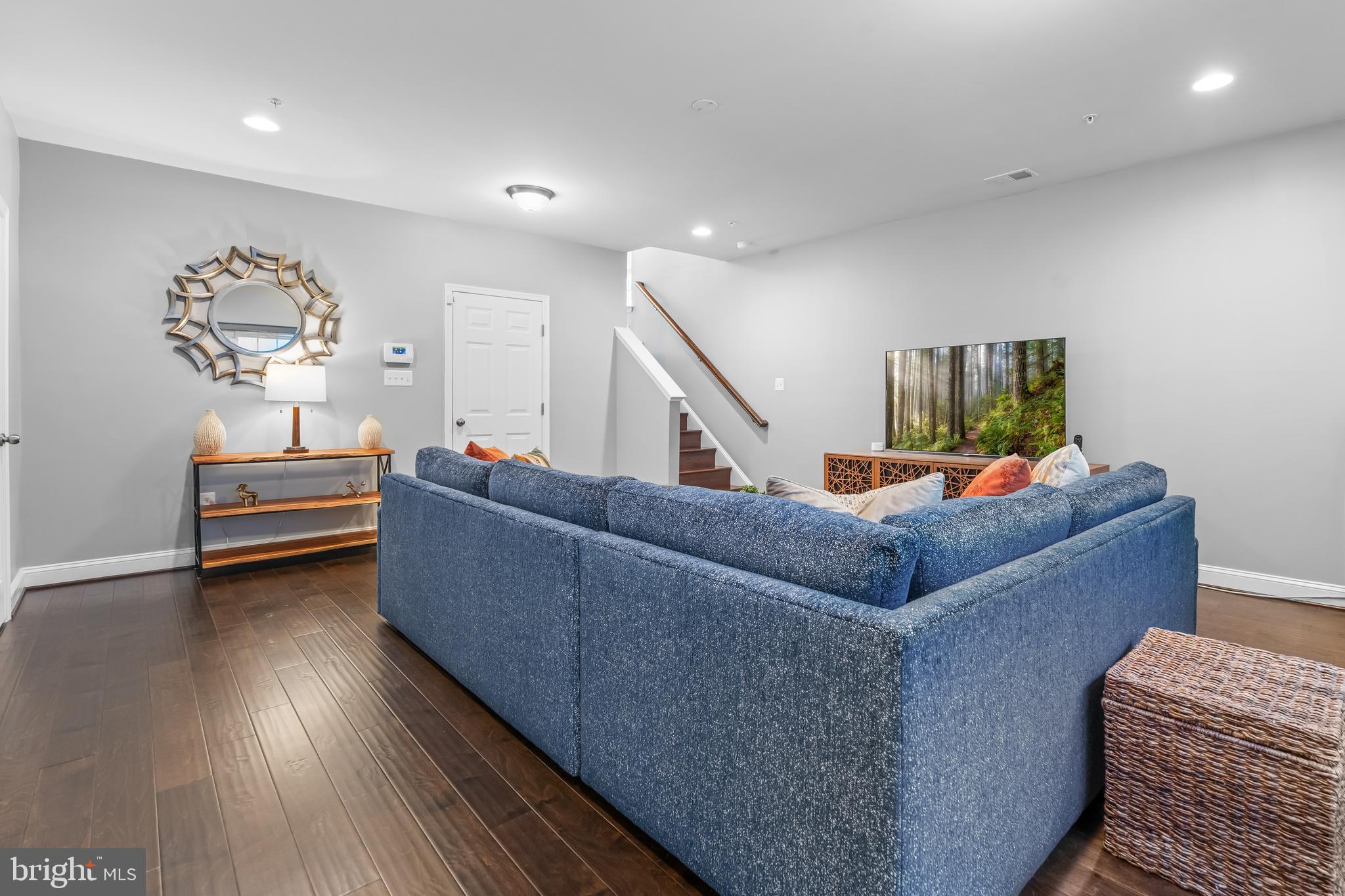 7820 Loblolly Way Hanover, MD 21076 - Photo 46 of 75 a living room with furniture and a wooden floor