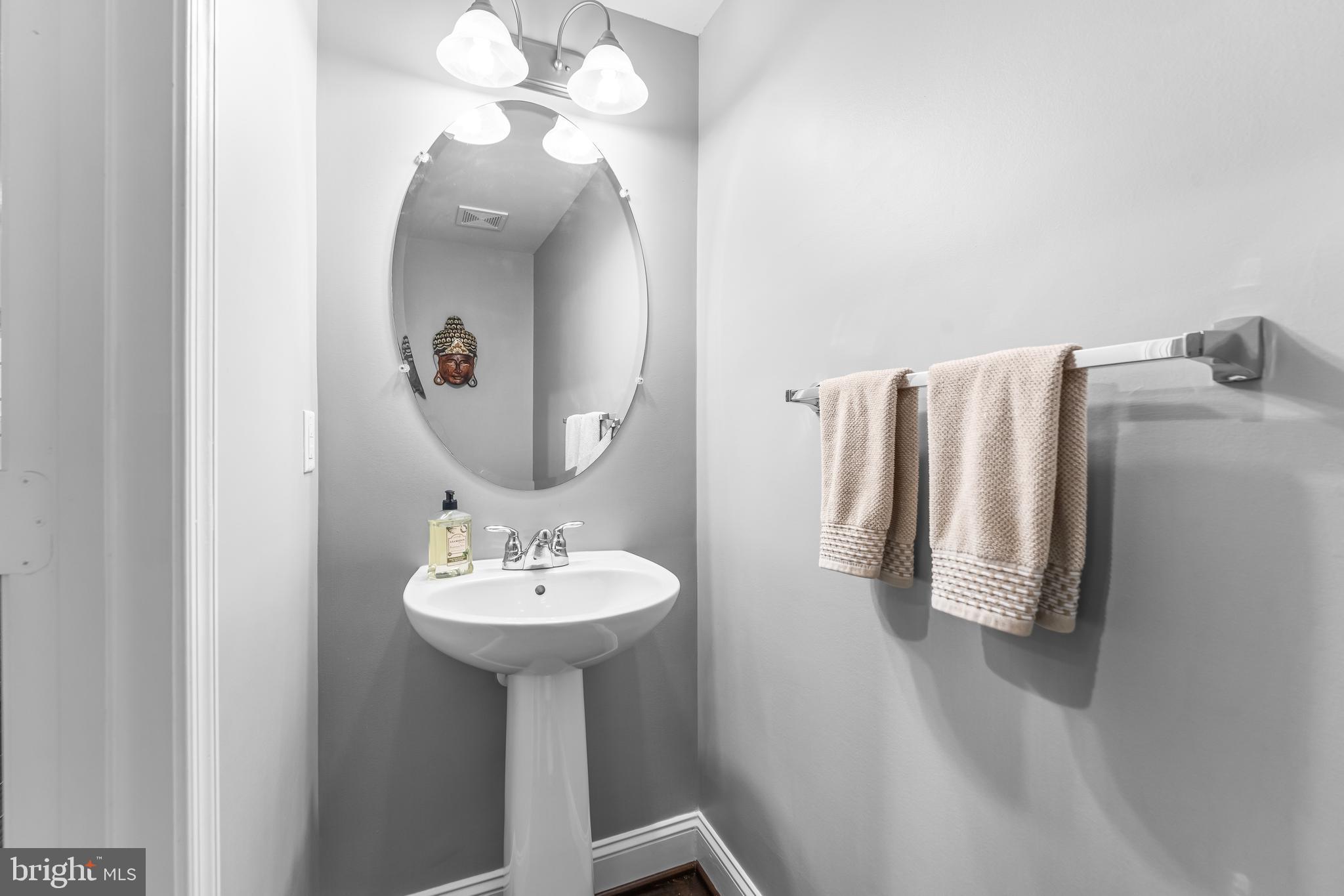 7820 Loblolly Way Hanover, MD 21076 - Photo 48 of 75 a bathroom with a sink a mirror and bathtub