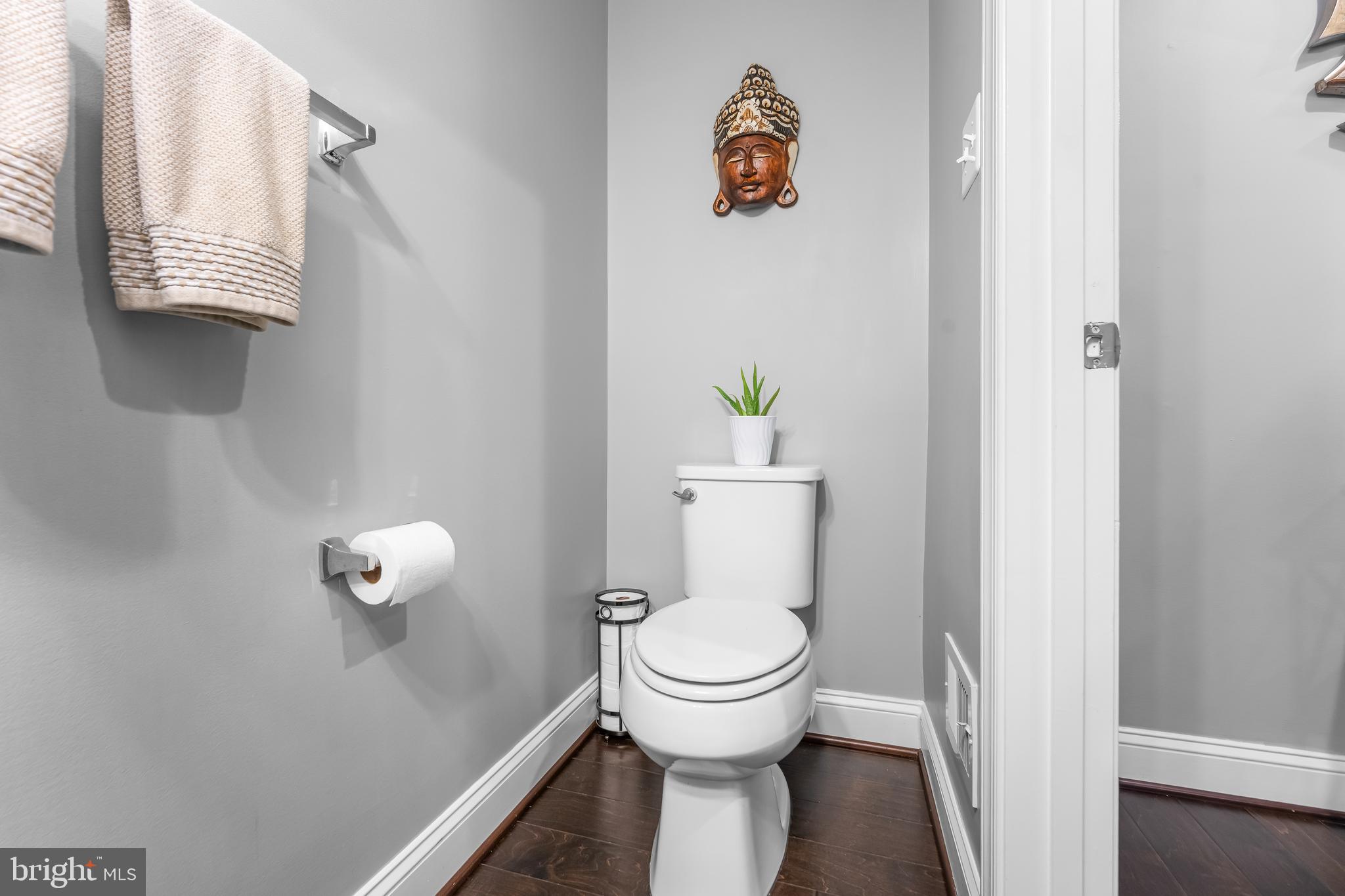 7820 Loblolly Way Hanover, MD 21076 - Photo 49 of 75 a white toilet sitting next to a bathroom sink
