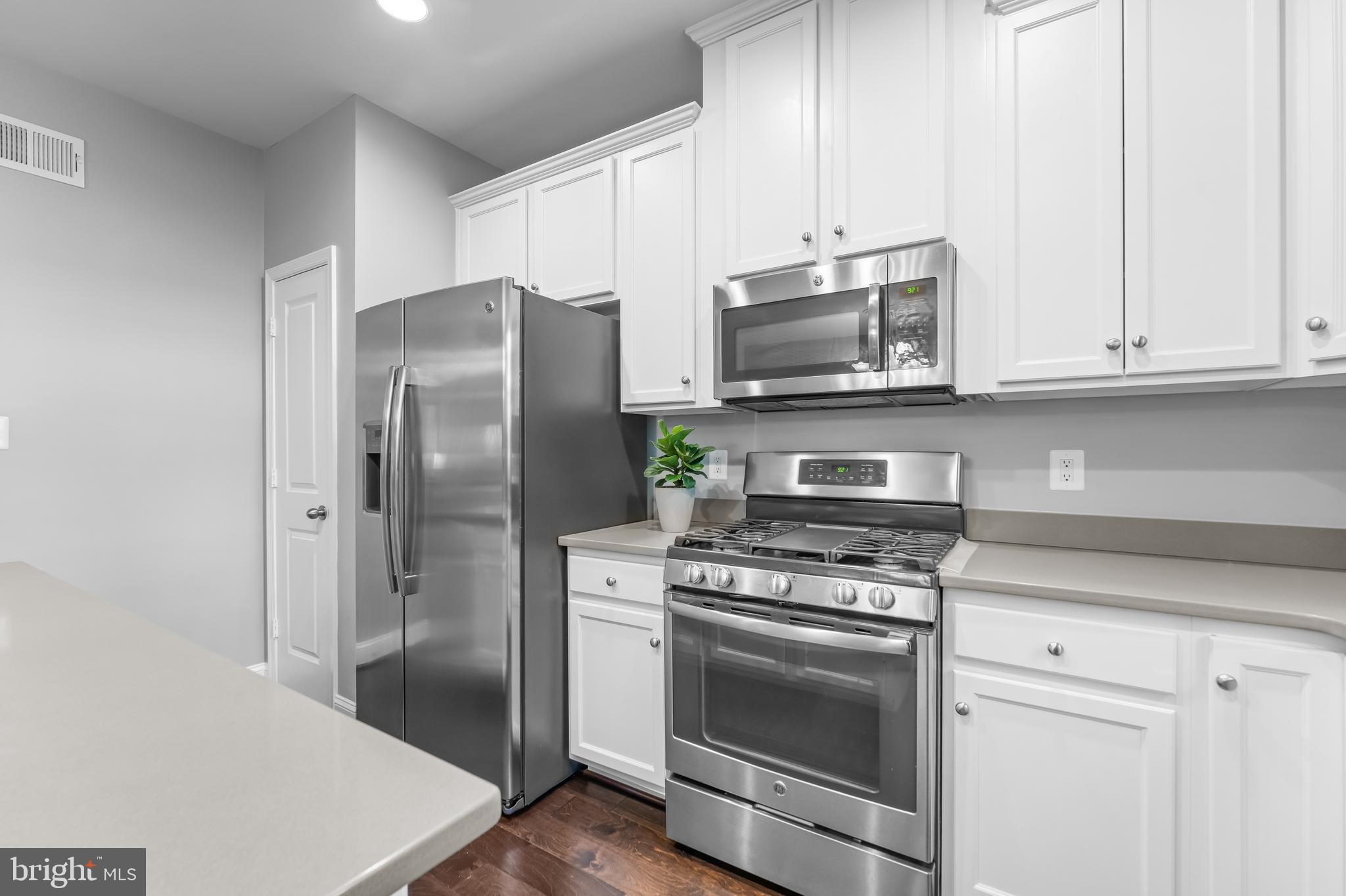 7820 Loblolly Way Hanover, MD 21076 - Photo 5 of 75 a kitchen with stainless steel appliances granite countertop a refrigerator stove and sink