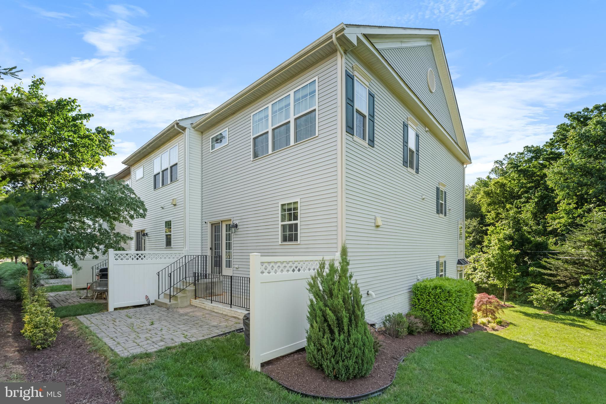 7820 Loblolly Way Hanover, MD 21076 - Photo 53 of 75 a front view of a house with a garden