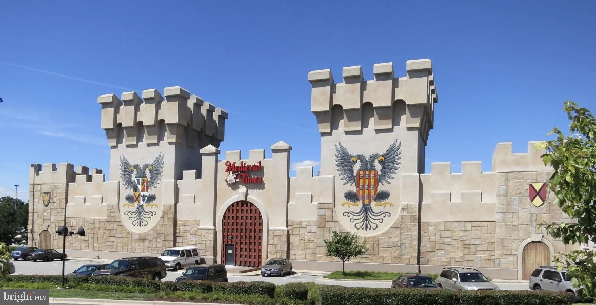 7820 Loblolly Way Hanover, MD 21076 - Photo 75 of 75 a front view of a building with glass windows and plants