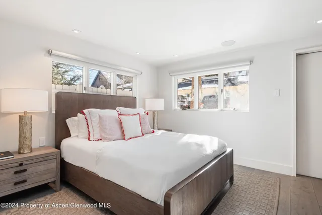 a bed room with a bed and a window