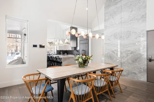 a view of a dining room with furniture and window