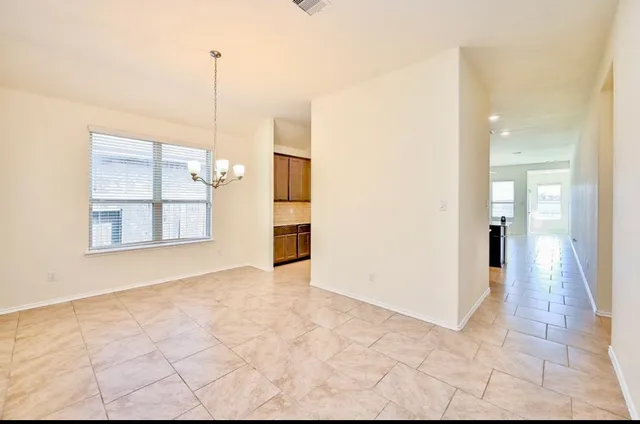 a view of an empty room and window