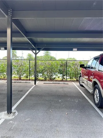a view of a parking space in front of a house