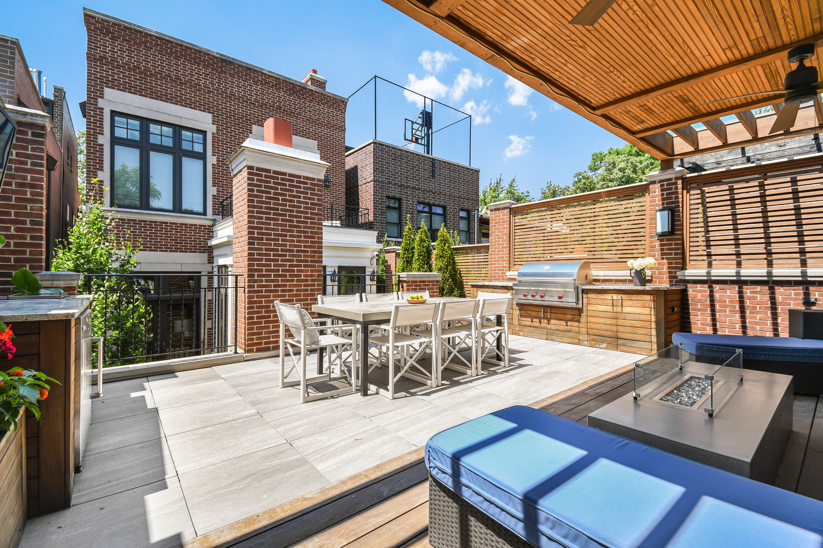 3751 North Greenview Avenue Chicago, IL 60613 - Photo 16 of 52 a view of a patio with a dining table and chairs with wooden floor
