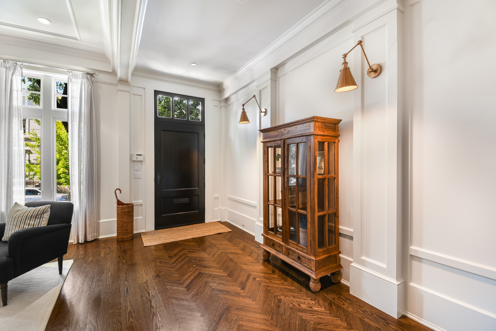 3751 North Greenview Avenue Chicago, IL 60613 - Photo 2 of 52 a view of a hallway with wooden floor and windows
