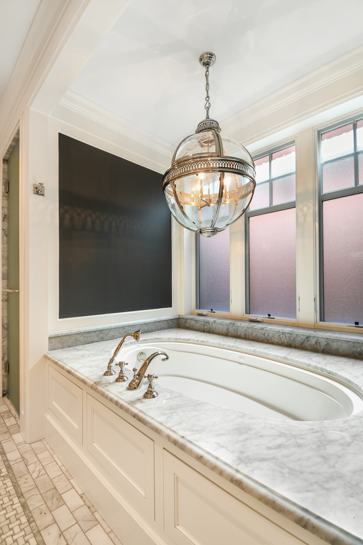 3751 North Greenview Avenue Chicago, IL 60613 - Photo 24 of 52 a bathroom with a sink and a mirror