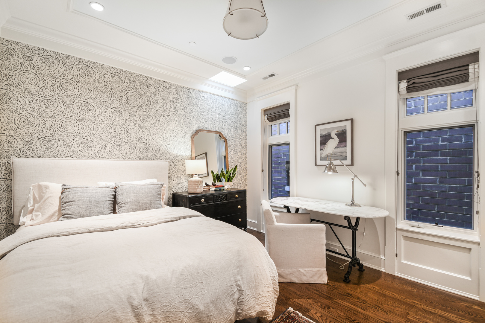 3751 North Greenview Avenue Chicago, IL 60613 - Photo 30 of 52 a bedroom with a bed and wooden floor