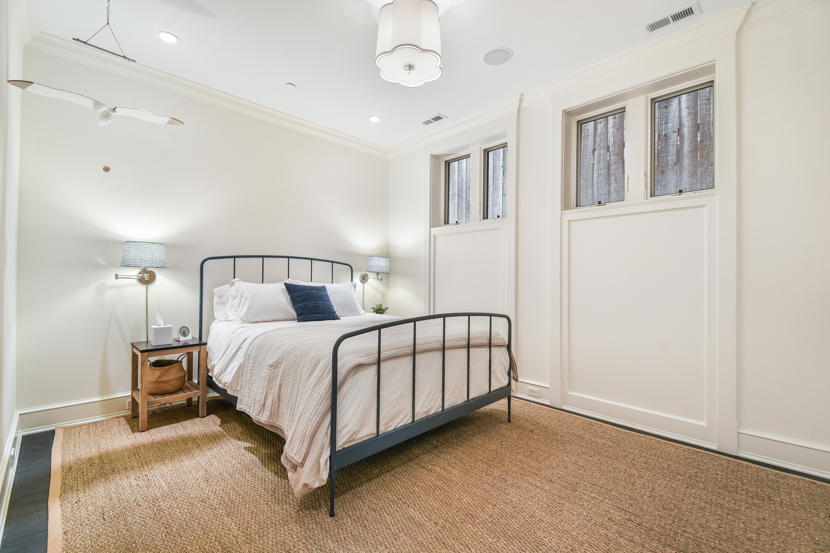 3751 North Greenview Avenue Chicago, IL 60613 - Photo 42 of 52 a bedroom with a large bed and a chandelier