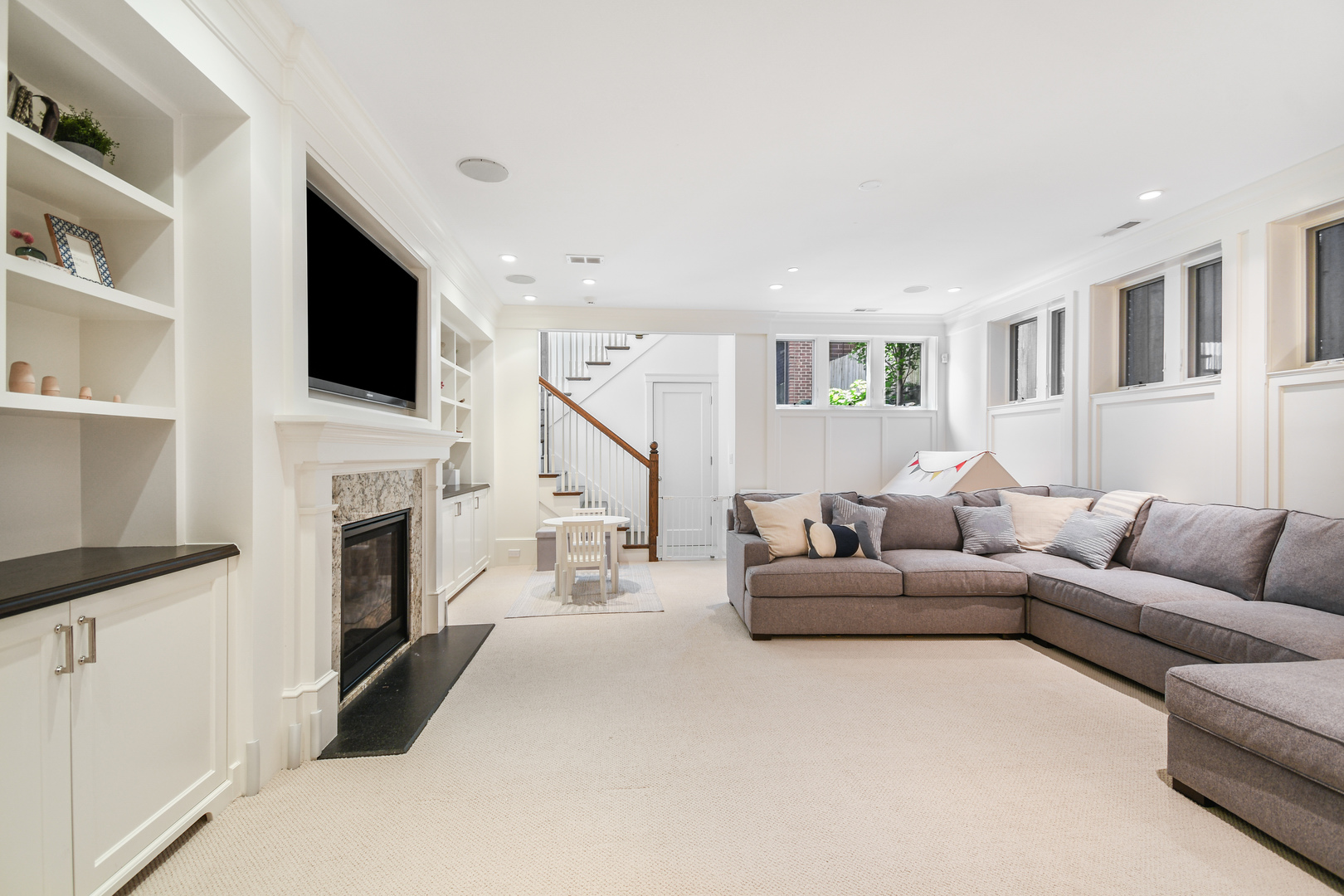 3751 North Greenview Avenue Chicago, IL 60613 - Photo 46 of 52 a living room with furniture a fireplace and a flat screen tv