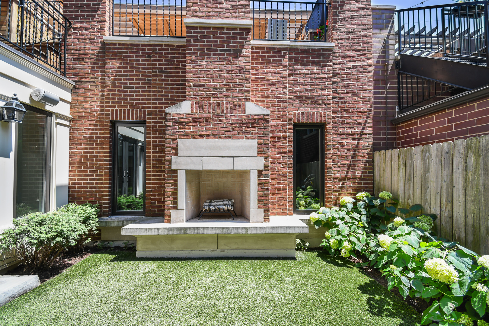 3751 North Greenview Avenue Chicago, IL 60613 - Photo 49 of 52 a view of a house with a yard and flower garden
