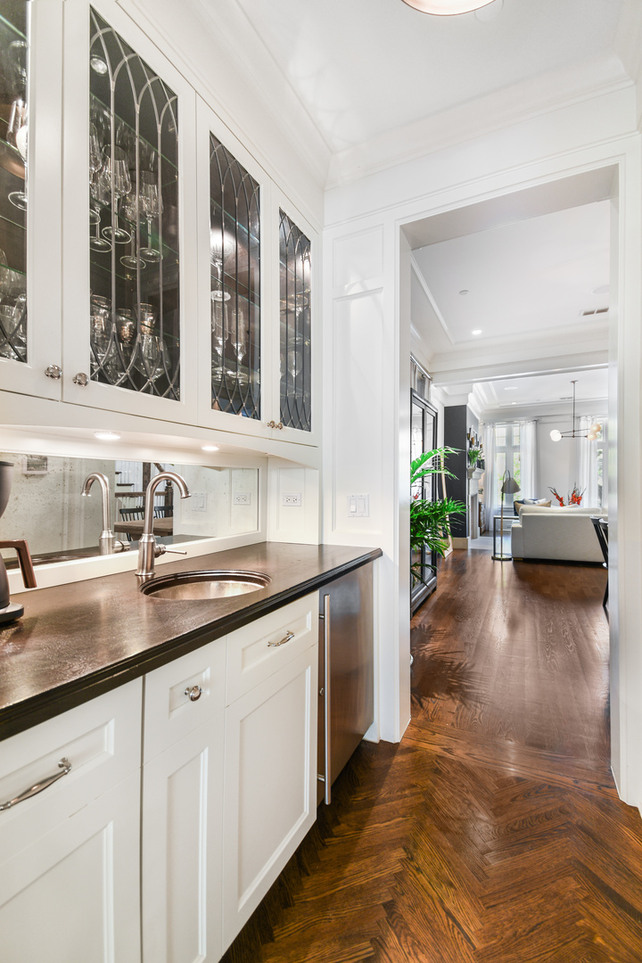 3751 North Greenview Avenue Chicago, IL 60613 - Photo 8 of 52 a view of a kitchen with a sink and dishwasher with wooden floor