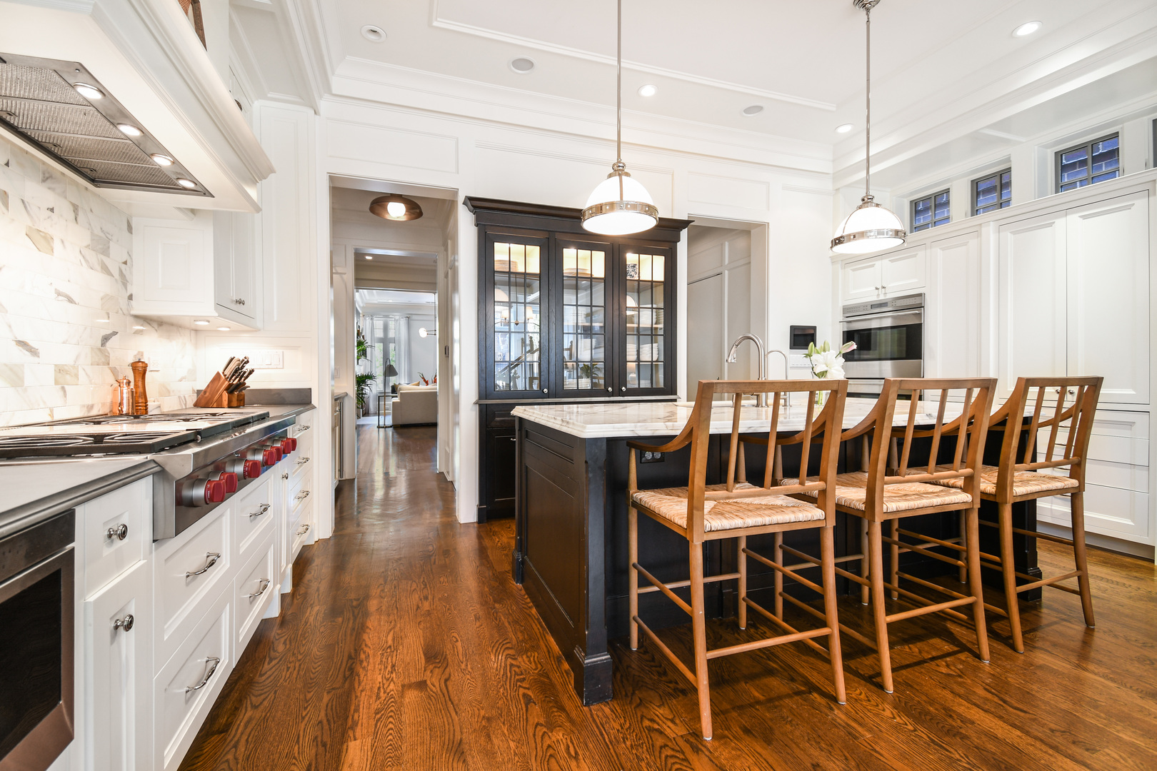 3751 North Greenview Avenue Chicago, IL 60613 - Photo 9 of 52 a kitchen with stainless steel appliances granite countertop a stove a sink dishwasher a dining table and chairs with wooden floor