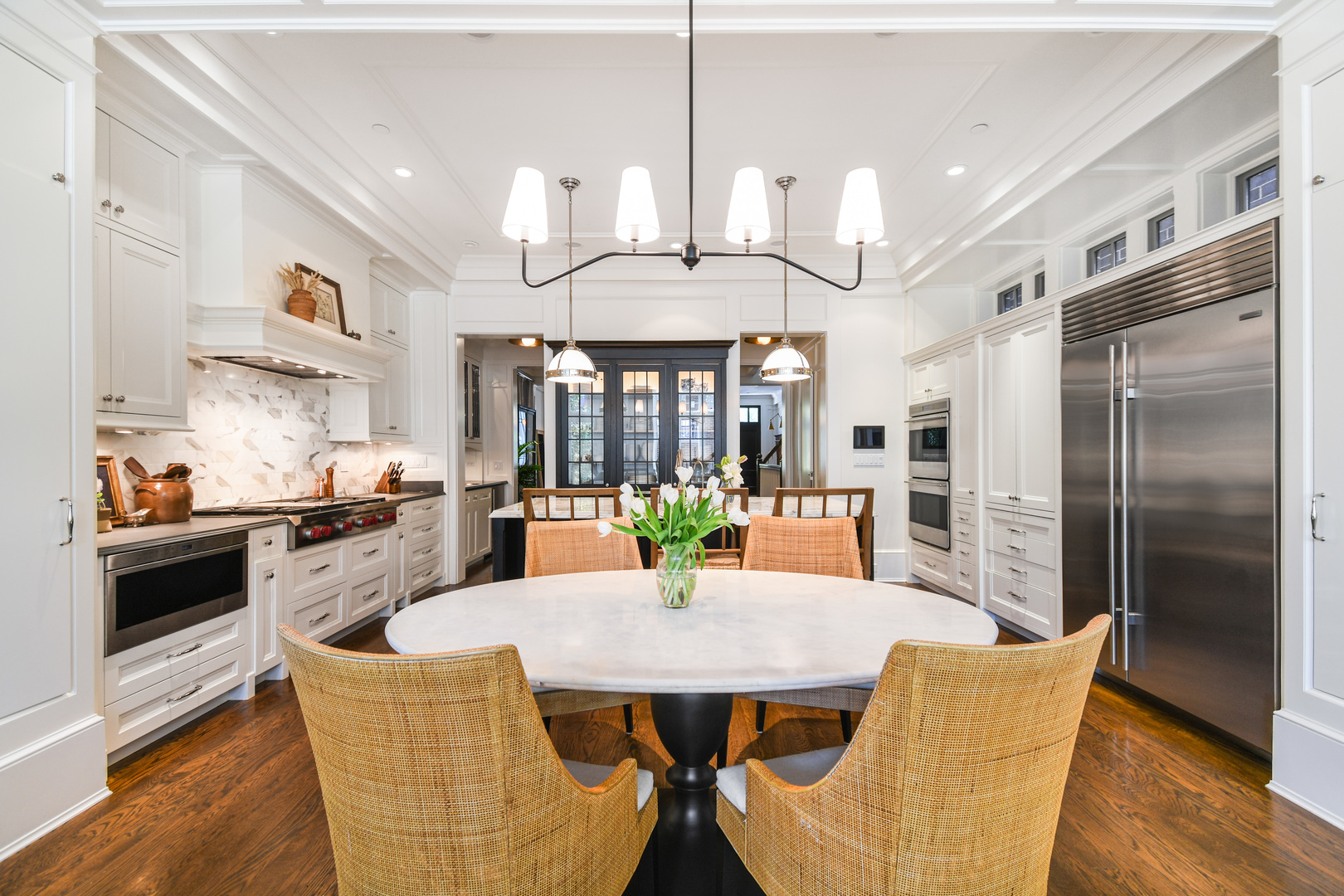 3751 North Greenview Avenue Chicago, IL 60613 - Photo 10 of 52 a view of a dining room with furniture a kitchen and chandelier
