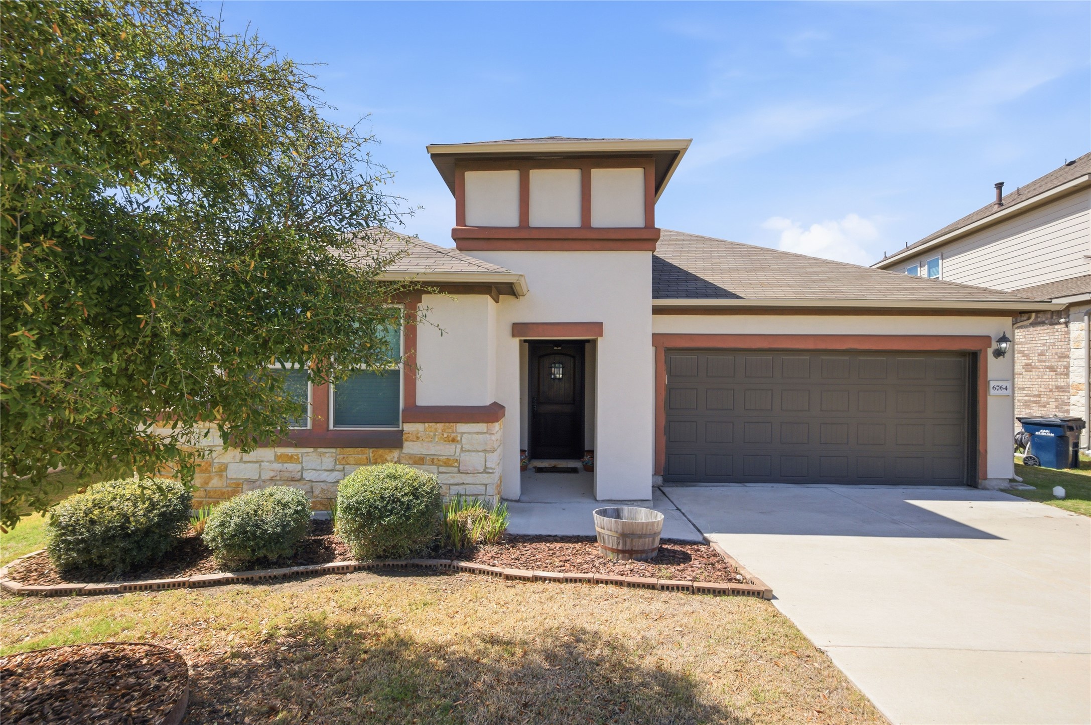 6764 Catania Loop Round Rock, TX 78665 - Photo 1 of 33 a front view of a house with garden