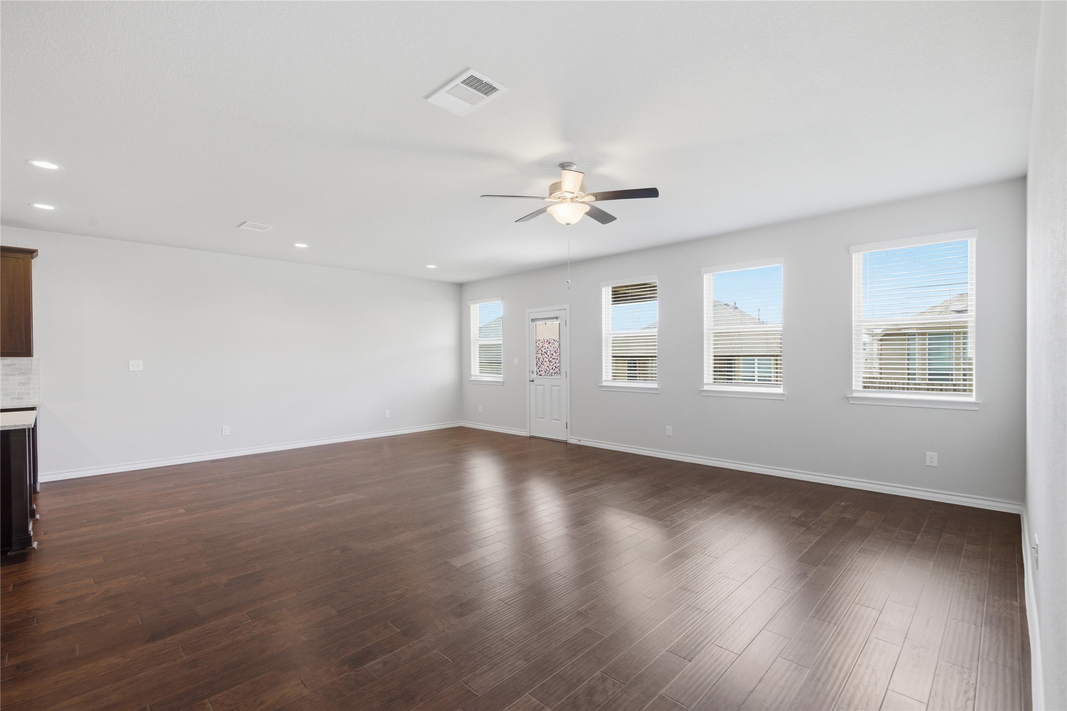 6764 Catania Loop Round Rock, TX 78665 - Photo 18 of 33 a view of an empty room with wooden floor and a window