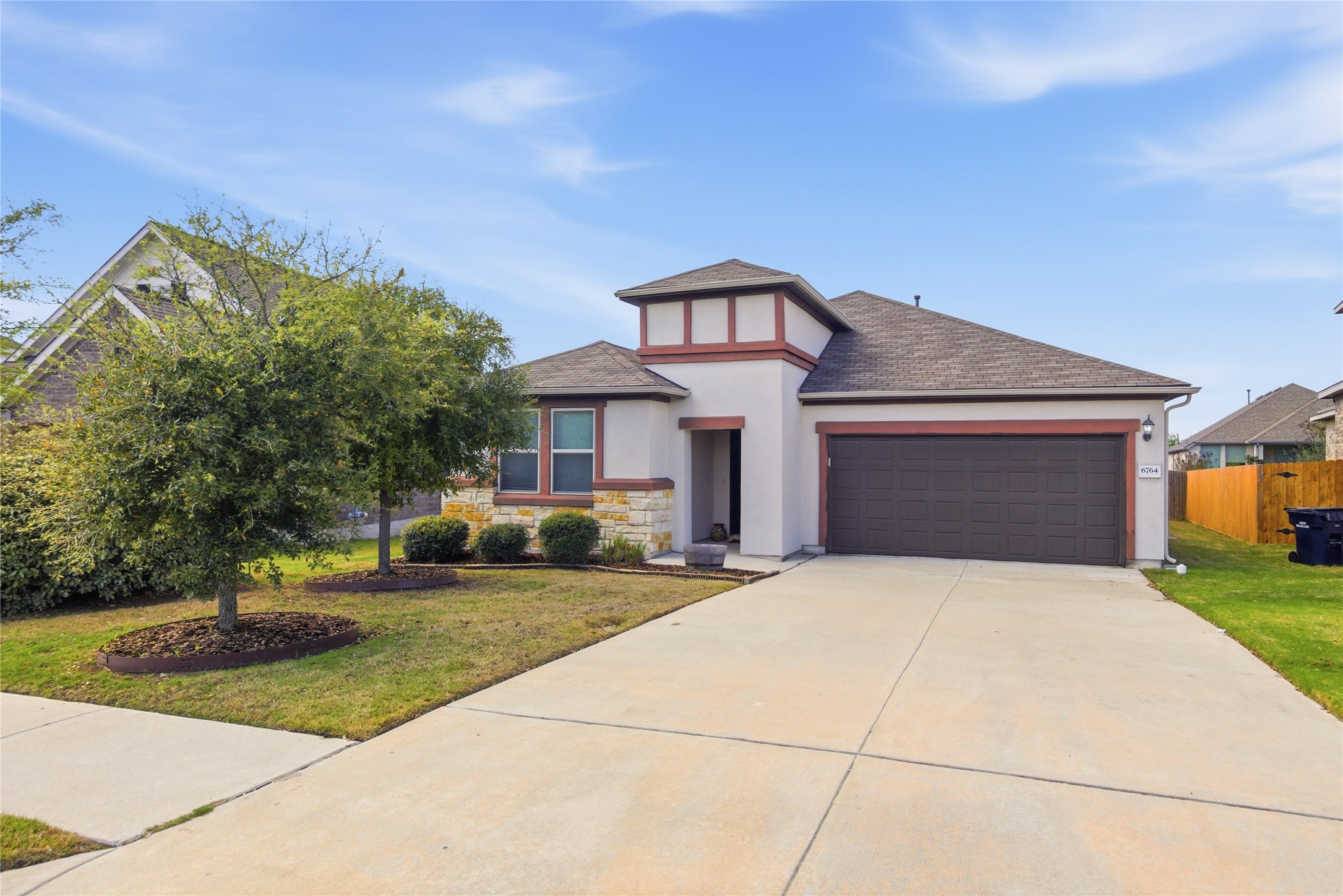 6764 Catania Loop Round Rock, TX 78665 - Photo 2 of 33 a front view of a house with a yard